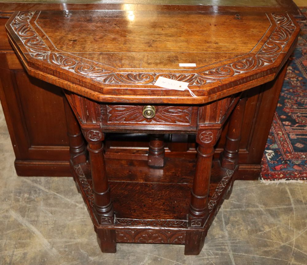 An 18th century style carved oak folding tea table, W.82cm, D.41cm, H.76cm